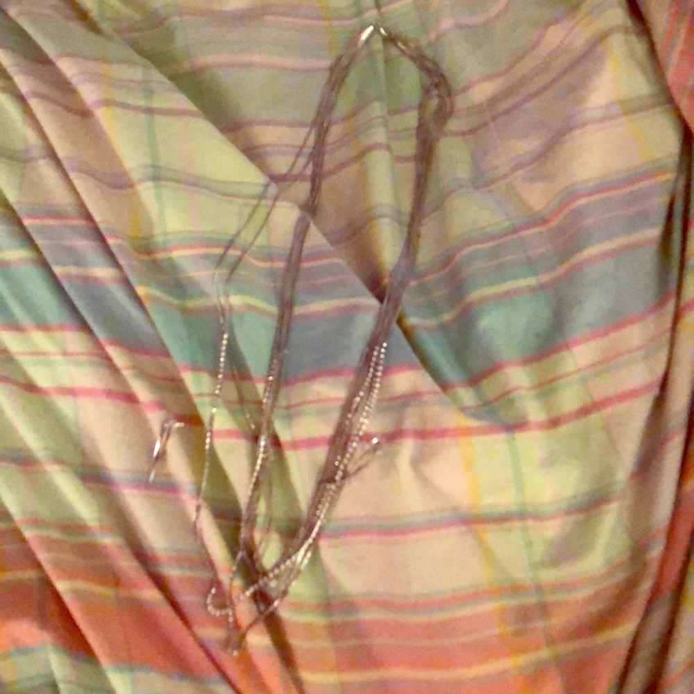 Silver necklace with matching earrings.